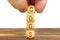 A man puts wooden cubes on the table with the inscription - COGS
