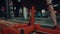 Man putting barbell plate on gym stand