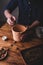 Man Putting Clay Pebbles into Terracotta Pot