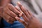 Man Putting An Engagement Ring On Woman`s Finger