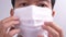 Man putting on face mask against virus bacteria prevention outbreak. The concept health and safety