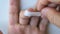 Man putting medical adhesive tape waterproof sticking plaster on cuts wound on finger. Male applying band aid patch to