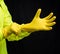 Man putting on protective gloves over black background