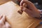 Man putting stamp on envelope ready to send mail