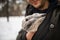 Man with a rabbit. The boy gently hugs a gray fluffy rabbit, a happy childhood