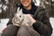 Man with a rabbit. The boy gently hugs a gray fluffy rabbit, a happy childhood