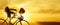 Man racing cyclist on sunset background. Man in yellow cycling jersey