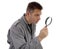 Man with raincoat is looking with magnifying glass over white ba