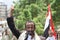 A man raises the Yemeni flag