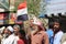 A man raises the Yemeni flag and participates in peaceful demonstrations in Yemen