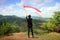 A man raising the Indonesian flag