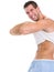 Man raising shirt to show abdominal muscles