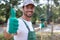 Man with rake for autumn leaves clean-up showing thumb-up