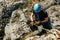 Man rappelling on the cliff