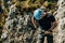 Man rappelling on the cliff