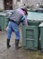 Man reaching in Recycle bucket