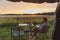 Man reading a book at a campsite