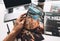 Man reading comic books on the white table in between work