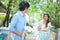 Man ready to give flowers to girlfriend