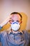 Man with real Coronavirus COVID-19 disease symptoms wears a protective mask