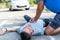 Man receiving first aid after a car accident