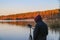 Man records the sounds of nature on a recorder on the lake