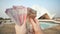 A man recounts Indian money in his hand. Hands close up.