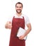 Man with red apron makes a gesture thumb up