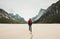 Man with red backpack walking alone