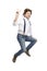 A man with red hair in a white shirt and jeans jumps and shows the victory sign. Isolated on white background. Vertical