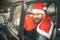 Man in red hat deliver xmas gifts in retro car