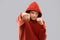 Man in red hoodie fighting with fists or boxing