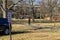 A man in a red jacket with a red backpack  on an electric unicycle with a helmet at Centennial Park