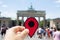 Man with a red marker in the Brandenburg Gate