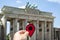 Man with a red marker at the Brandenburg Gate