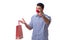 Man with a red nose funny holding a shopping bag gift present is