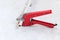 Man with red scissors cut pipes for heating, or water. polypropylene mounting system