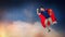 Man in red superhero cape flying over night sky