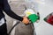 Man Refill and filling Oil Gas Fuel at station.Gas station - refueling.To fill the machine with fuel. Car fill with gasoline at a