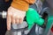 Man refilling the car with fuel on a petrol filling station