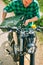 Man refilling the gas tank of a motorbike