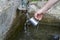 A man refilling spring water