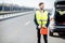 Man with refuel canister on the roadside