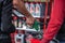 Man refueling the car at a gas station using apump