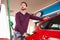 Man refuelling a car at a petrol station
