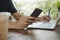 Man relaxed using social network on digital mobile phone with virtual digital icon, laptop on desk