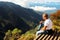 Man relaxes on the edge of the cliff . Plateau ` End of the World ` , Sri Lanka