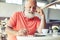 Man relaxing with cup of coffee and tablet pc