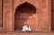 Man relaxing at Jama Masjid Mosque, Delhi