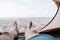 Man relaxing in a tent in front of sea.